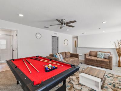 Loft area with a smart tv and  a pool table