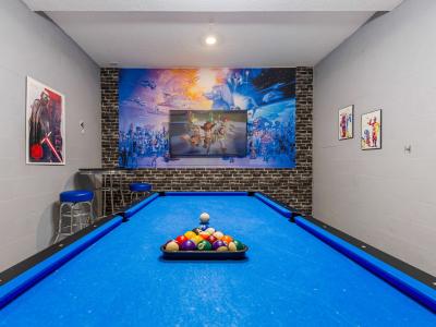 Game area with a pool table and a Smart TV