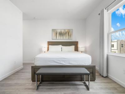 Bedroom 2 with a king size bed and  a private shower