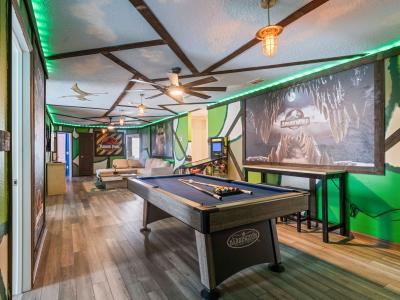 Loft area with a pool table and an arcade games