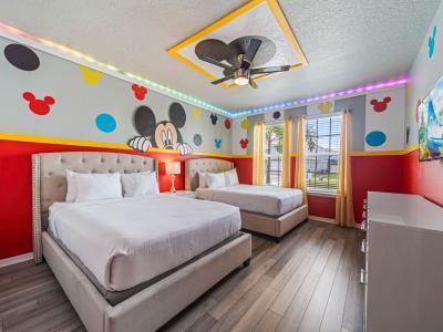 Bedroom 1 with 2 double beds and smart TV