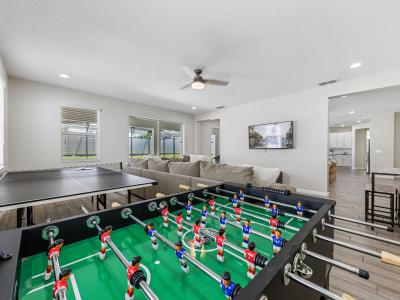Entertainment area with foosball table and ping pong table