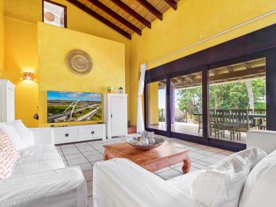 Spacious living room with smart TV and sliding doors to patio (1)