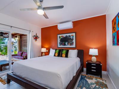 Main Bedroom 1: King-Size Bed, TV, and Attached Bathroom - Comfort and Convenience Combined!