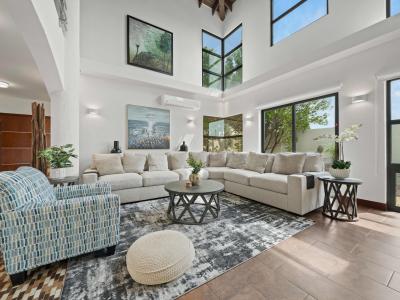 Beautifully decorated living room with high ceilings