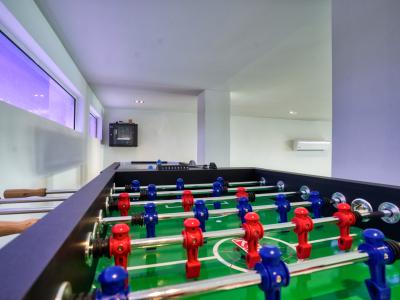 Unleash your competitive spirit in our game area featuring a thrilling foosball table – where laughter, camaraderie, and epic matches await!