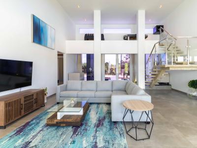 Opulent Living Area of the Villa in Noord Aruba - Smart TV and Netflix - Chic and contemporary living room design with clean lines and modern furnishings - Comfy Sofas - Play Area for fun time