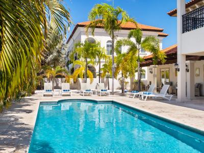 Splendid Private Pool of the Villa in Noord Aruba - Cosy beach chairs available - Dive into refreshing poolside escape - Immerse yourself in the cool elegance of our pool - Experience ultimate relaxation in our poolside paradise