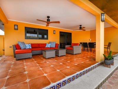 Lush outdoor lounge of the 4BR House in Noord Aruba - A breath of fresh air - Create memories with you Family and Friends - Ample Sitting options