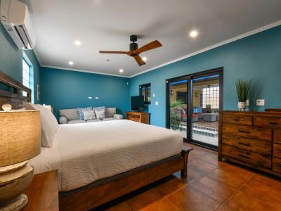 Elevated Bedroom of the 4BR House in Noord Aruba - Modern and stylish decor that complements the space - Inviting atmosphere designed for a restorative sleep - Smart TV and Netflix- Thoughtfully designed for comfort and style