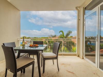 Step onto our inviting balcony, where a charming outside dining table awaits. With views of the surrounding beauty and the fresh breeze in the air, this al fresco setting is perfect for enjoying meals with loved ones or simply savoring a cup of coffee.