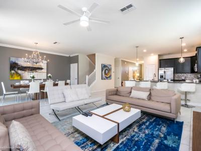 Lavish Home in Davenport Florida - This open layout of the dining and living Area and kitchen is professionally designed  - Decorated to give airy feel throughout the home - Versatile seating options