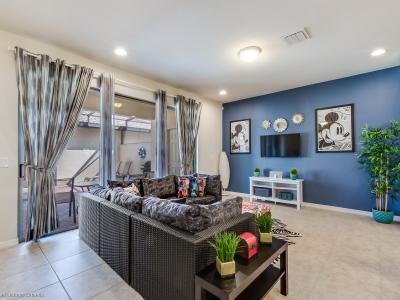 Spectacular living area of the apartment in Kissimmee - Cosy sofas - Elegantly decored living area - Large bright windows of the living area with Mesmerizing views - Beautifully tile furnished floor - Availability of TV and Netflix