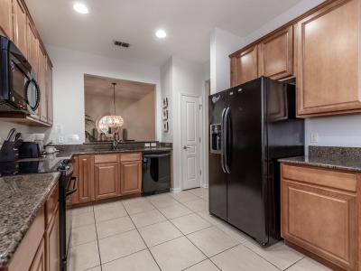 Charming kitchen of the home in Kissimmee, Florida - Fully Equipped  kitchen with sleek, stainless-steel appliances - Plenty of storage space available to keep counters organized