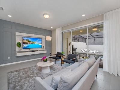 Modern living area of the townhouse in Polk County, Florida - Exquisitely decorated with calming hues - Living area with a nice pool view from the outside - Smart TV with Netflix for entertainment