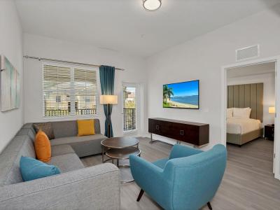 Bright living area of the condo in Orlando - Indulge in elegant entertainment in living area - Provides endless viewing options for your pleasure - Cozy Sofas - Smart TV and Netflix