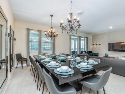 Imposing Dining Area of the Apartment in Florida Lake Nona Town Center - 12 Persons Dining - Sophisticated design with a blend of modern and classic elements - Artfully arranged table settings for a touch of elegance