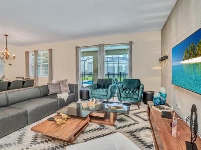 Modern Living Area of the Apartment in Florida near Boxi Park - Smart TV and Netflix - Thoughtful mix of textures, from plush rugs to tasteful throw pillows - Cozy seating area conducive to relaxation and socializing