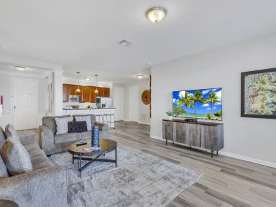 Relaxation Oasis: Sink into the sumptuous sofa, surrounded by stylish accents and warm hues, making this living room a true haven for relaxation