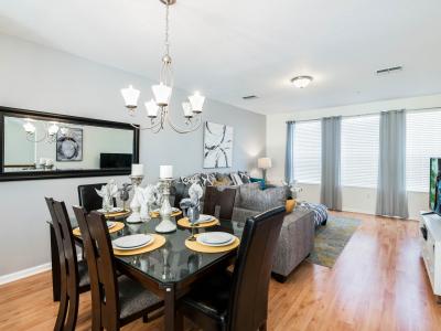 Bask in the warmth of natural light streaming through the windows, illuminating our dining and living room with a radiant ambiance, perfect for cozy gatherings and tranquil moments.