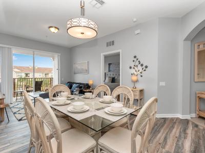 Sophisticated Gathering: Indulge in a sophisticated dining experience in our condo, where the dining area is adorned with stylish furnishings for an upscale stay