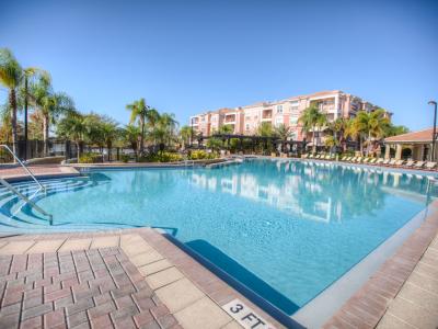 - Dive into paradise at Vista Cay Resort's expansive pool in Orlando - Where the sparkling water invites you to relax, refresh, and revel in the beauty of leisure. - Immerse yourself in luxury and tranquility.