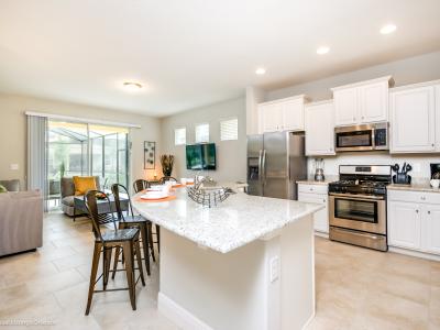 Sleek kitchen of the home in Davenport Florida - It blends style and practicality effortlessly - Fully equipped kitchen - Integrated appliances for a seamless and stylish appearance - Stainless steel appliances