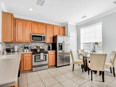 The Heart of the Home: This townhouse features an open-concept kitchen seamlessly connected to the dining area, making it effortless to serve and enjoy your meals.