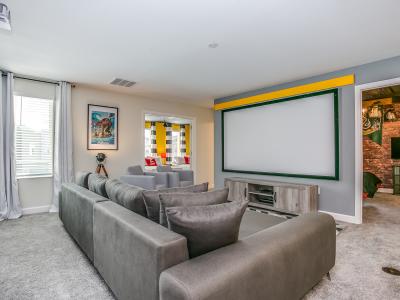 Cinematic Comfort: Immerse yourself in luxury in our spacious living room, featuring a projector and a clean white backdrop – the perfect setting for a private movie night.