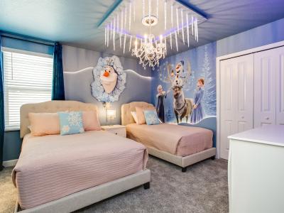 Kid's bedroom with a Frozen themed wallpaper- be in a magical space of this home