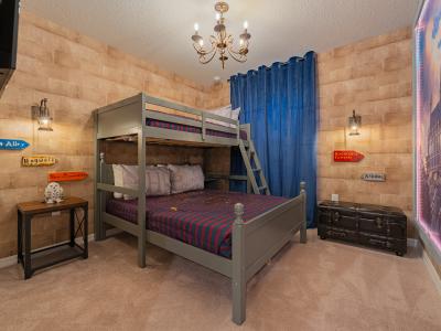 Harry Potter-inspired bedroom of the home in Davenport, Florida - Bunk bed layout, inviting young wizards to embark on magical journeys - Vibrant, enchanting hues transport you to the wizarding realm - Smart TV for kids entertainment