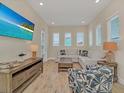 - Sleek living area of the cottage in Reunion Florida - Sink into the plush sofas, unwind after a day of adventure - Tasteful decor and inviting ambiance - Smart TV and Netflix - The perfect place to relax and socialize