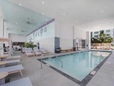 Urban Elegance, Poolside Bliss: Dive into sophistication at our indoor pool, seamlessly integrated into the chic ambiance of this Miami apartment building. Elevate your stay with a refreshing swim.