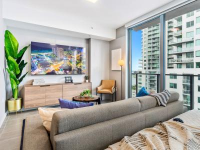 Living/sleeping area w/ king bed, 65" Smart TV - Capturing the amazing views of the city from your own spot at this charming studio apartment.