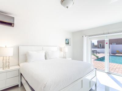 Resplendent Bedroom of the 3BR house in Noord Aruba - Modern bedroom with sleek design and natural light - King Size Comfy Bed - Cozy retreat with a plush bed, perfect for relaxation