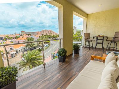 Balcony with cozy seating and vie of the Palm Beach Strip